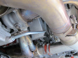 Left side installed, 993 Turbo.  TurboKraft turbocharger oil return pipe set,  aka scavenge line set, p-trap oil line set