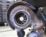 TurboKraft's stainless turbocharger turbine heat shield installed on Garrett GT3582R turbocharger, 1982 930/911 Turbo